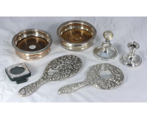 Two various silver-backed hand-mirrors, a squat candlestick and capstan inkwell together with two various silver-plated wine 