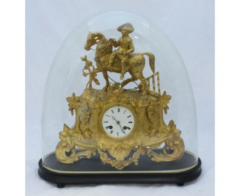 A 19th century gilt-spelter mantel clock modelled with a boy and plough horse, on rococo foliate base, with eight-day movemen