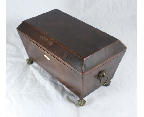 A 19th century twin-handled stained rosewood sarcophagus tea caddy, the interior with three lidded compartments, proud ivory 