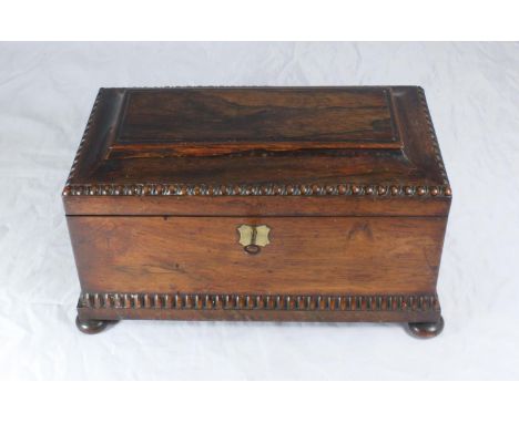 A 19th century rosewood tea caddy, of rectangular sarcophagus form with two lidded caddies and cut-glass mixing bowl, 34cm wi