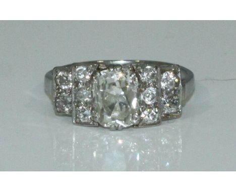 An antique Platinum &amp; Diamond Ring, centrally six double-claw set with an oval faceted diamond estimated 1.50 carats, I-c