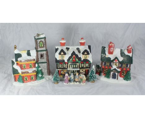 A hand-painted ceramic 'Illuminated Christmas Village' in original box and packaging 