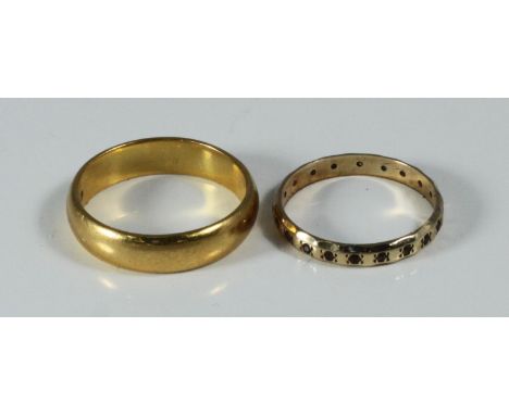 A 22ct gold wedding band, 7.7 grams, ring size T, together with a 9ct gold wedding ring, 1.5 grams, ring size P (2) 