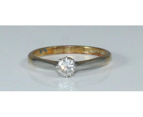 An 18ct Gold and Platinum Solitaire Diamond ring, claw set a round brilliant cut diamond estimated 0.25ct, 2.1 grams 