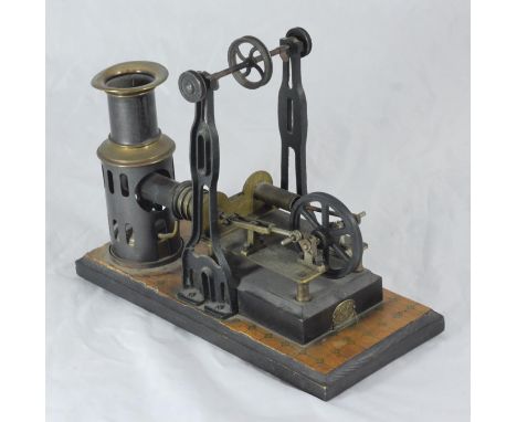 An early 20th century Ernst Plank static table-top steam engine with twin-pistol flywheel crank, mounted on wooden base, appr