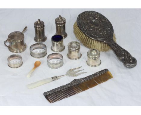 A small selection of assorted silver items including a silver-backed brush, a comb, mustard and spoon and napkin rings etc. 