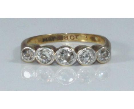 An 18ct gold five-stone diamond ring, Old Cut diamonds, estimated total diamond weight 0.80 carats, 3.1 grams 