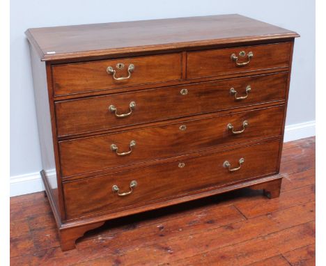 A 19th century mahogany chest of two short over three long, graduated drawers with original brass loop handles and escutcheon