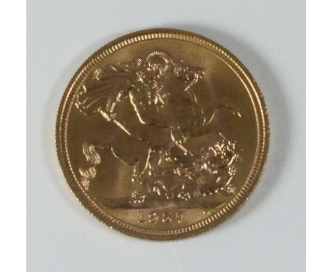 A 1957 ERII gold sovereign, first portrait, in red fitted box 