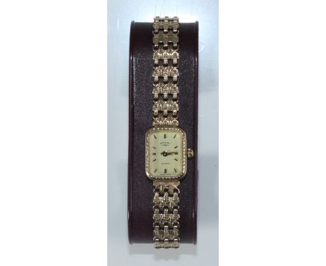 A ladies 9ct gold Rotary cocktail watch, the rectangular champagne dial with batons denoting hours, on 9ct gold bracelet, gro