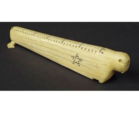 Antique scrimshaw cribbage board in the form of a walrus, 11" long