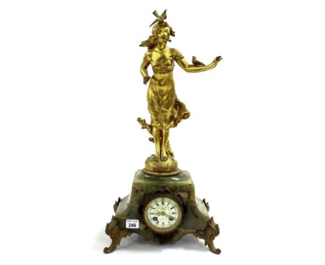 Decorative French figural gilt metal and green onyx mantel clock, with 3" enamel dial, applied with a standing lady and birds