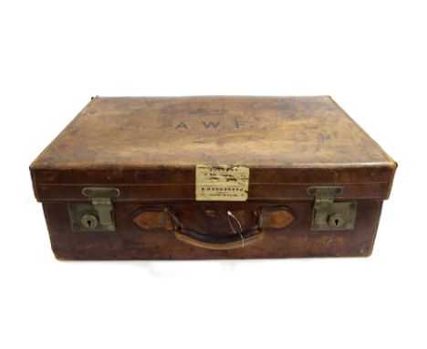 Vintage brown leather suitcase/dressing case, with interior fitted to take bottles and dressing items, monogrammed AWF to the
