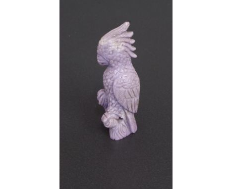 Carved lavender jade, modelled as a Cockatoo perched on a rock, 6cm high
