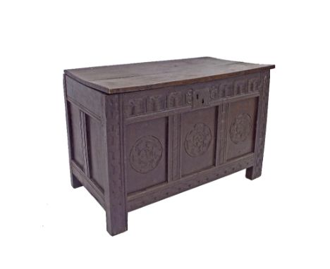 Antique oak triple panel coffer, with darted borders and panels carved with a roundel decoration upon stylised stile supports