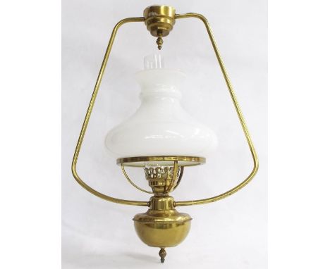 Brass hanging oil lamp converted to electricity with clear glass flue and opaline glass shade, 21" high