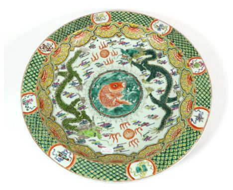 A Chinese Porcelain Dish, Kangxi reign mark but not of the period, painted in famille verte enamels with a central panel of c