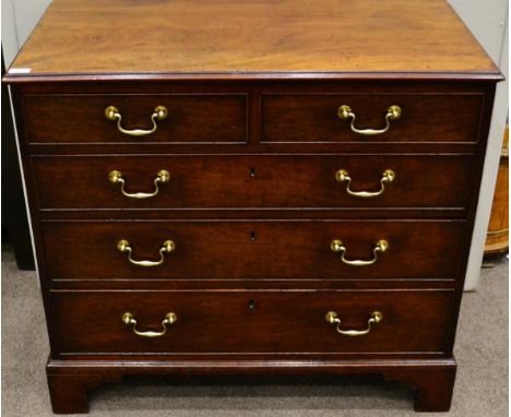 A George III Mahogany Straight Front Chest of Drawers, circa 1800, the moulded top above two short and three long graduated d
