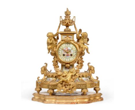 An Ormolu Striking Mantel Clock, retailed by Howell &amp; James, Paris, circa 1890, surmounted by an urn finial and decorated