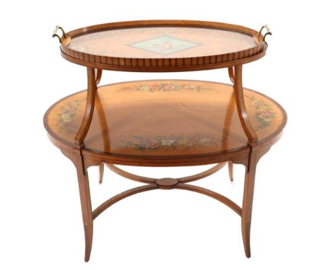 A Satinwood and Polychrome Decorated Two-Tier Étagère, late 19th/early 20th century, of oval graduated form, the top painted 