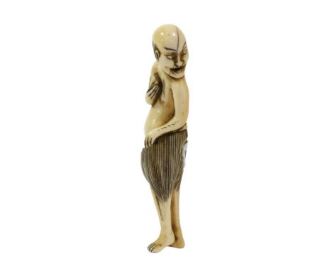 A Japanese Ivory Netsuke, Edo period, as a South Sea Island diver wearing a grass skirt holding a clam, 8cm high  Provenance: