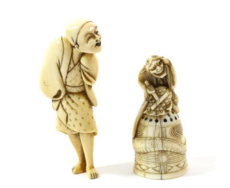 A Japanese Ivory Netsuke, Edo/Meiji period, as a standing figure in loose robes, 7.5cm high; and A Similar Netsuke, as an Oni