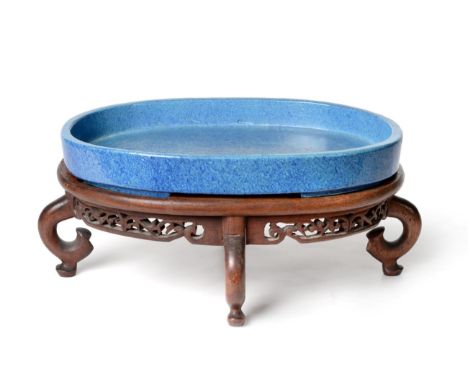 A Chinese Duck Egg Glazed Planter, Qing Dynasty, of shallow oval form with four bracket feet, 26.5cm wide, on a hardwood stan