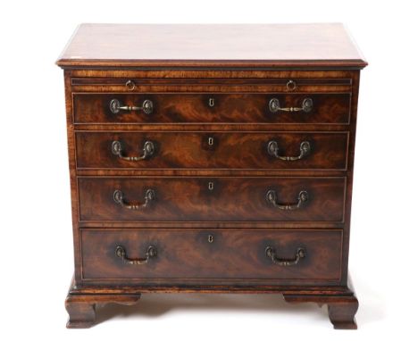 A George III Style Mahogany Five Drawer Dressing Chest, the moulded top with pull-out brushing slide, four graduated drawers 
