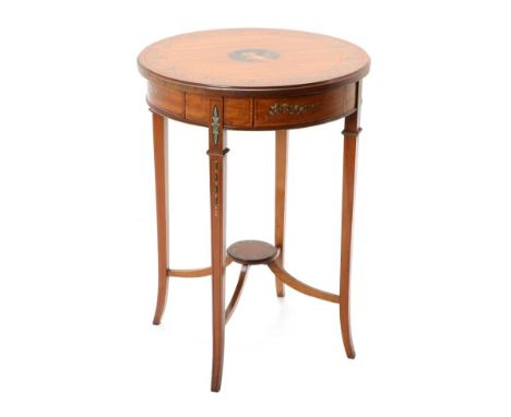 A Satinwood and Polychrome Painted Metamorphic Circular Occasional Table, late 19th/early 20th century, the pivoting top deco