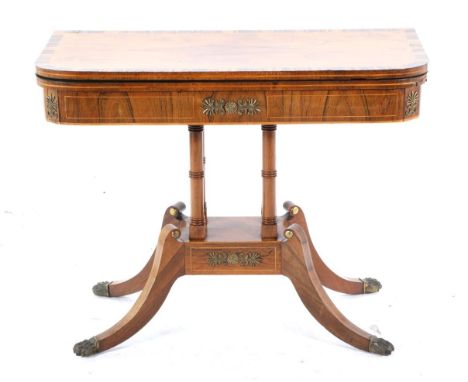 A Regency Rosewood and Calamander Crossbanded Foldover Card Table, early 19th century, the hinged lid enclosing a green baize