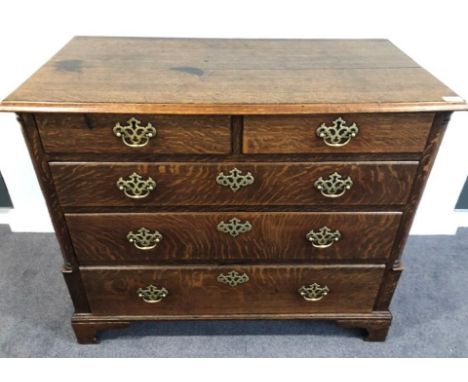 A George III Oak Straight Front Chest of Drawers, 3rd quarter 18th century, the moulded top above two short and three long gr
