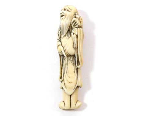 A Japanese Ivory Netsuke, Edo period, as a Sennin holding an octopus on his left shoulder, 9.5cm high