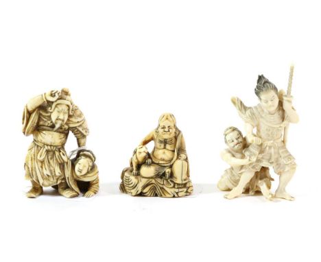 A Japanese Ivory Okimono, Meiji period, as a Samurai warrior holding down a kneeling woman, signed, 6.5cm high; A Similar Gro