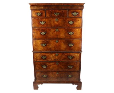 A George II Walnut and Featherbanded Chest on Chest, 2nd quarter 18th century, with a cushion drawer above three small drawer