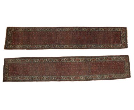 Pair of Bidjar Runners Iranian Kurdistan, late 19th century The Herati field enclosed by ivory borders of polychrome turtle m