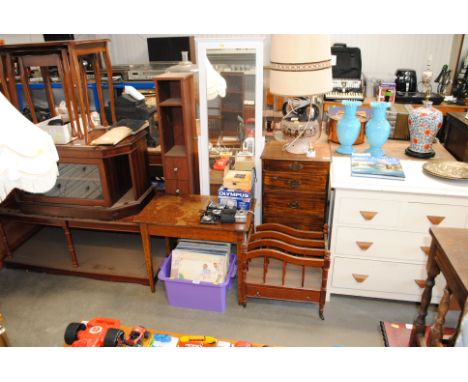 A mahogany chest, a Canterbury occasional table, a cheval mirror and a narrow shelf unit of fitted drawers