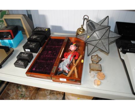 A mahogany case containing Pelham style puppet, star shaped light fitting, various trinket boxes