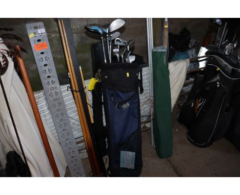 A golf bag and contents of Dunlop woods and irons 
