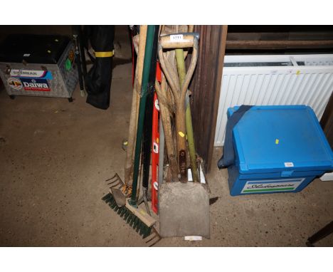 A bundle of long handled gardening tools 