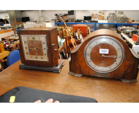 An oak cased two hole mantel clock and a walnut cased three hole mantel clock