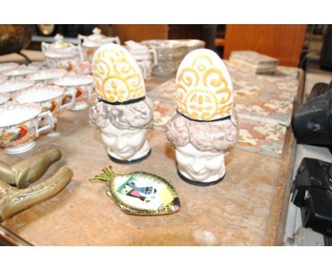 A pair of Quimper jugs and a Quimper fish shaped dish