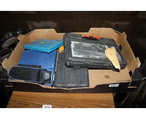 A box containing torches, a screwdriver etc.