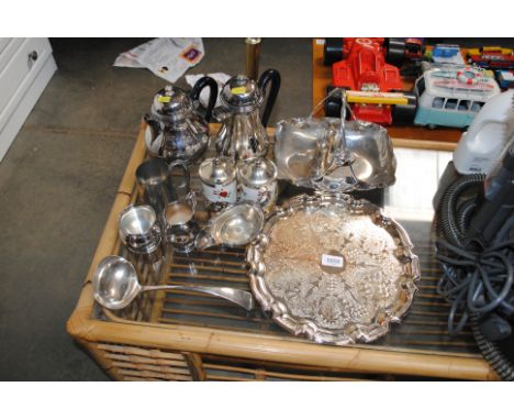 A collection of silver plated ware to include basket, tray, ladle etc.