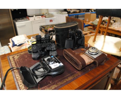 A Kodak camera, Ilford camera and two pairs of binoculars