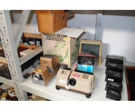 A slide projector, one other projector and a slide viewer