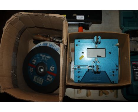 A box containing cutting discs, various tools, and a Joint Master