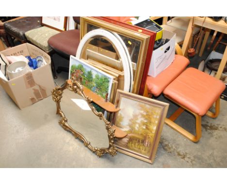 A collection of mirrors, wall shelf, various pictures and prints
