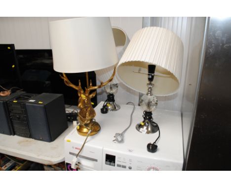 A pair of table lamps and a table lamp in the form of a stags head