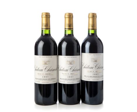 Three bottles of Château Charmail 1997, Haut Medoc, France.Category: Red wine.75 cl.The labels are slightly damaged.Level: C.
