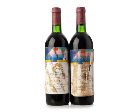 Two bottles of Château Mouton Rothschild 1984, Pauillac, France.Category: Red wine.75 cl.With damage to the labelling.Grade: 